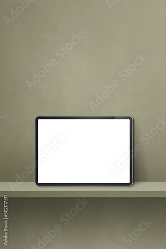 Digital tablet pc on green wall shelf. Vertical background banner
