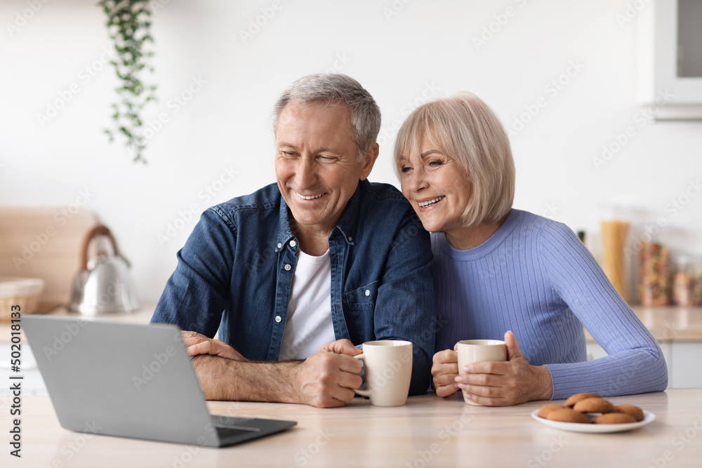 Beautiful mature couple enjoying time together at home Beautiful mature couple enjoying time together at home
