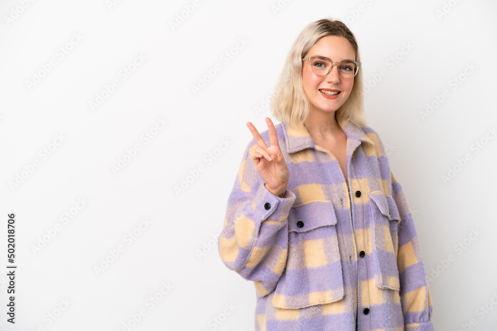 Young caucasian woman isolated on white background smiling and showing victory sign Young caucasian woman isolated on white background smiling and showing victory sign