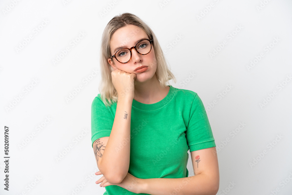 Young caucasian woman isolated on white background With glasses and with sad expression Young caucasian woman isolated on white background With glasses and with sad expression