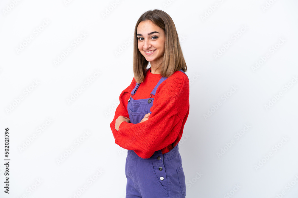 Young caucasian woman isolated on white background with arms crossed and looking forward Young caucasian woman isolated on white background with arms crossed and looking forward