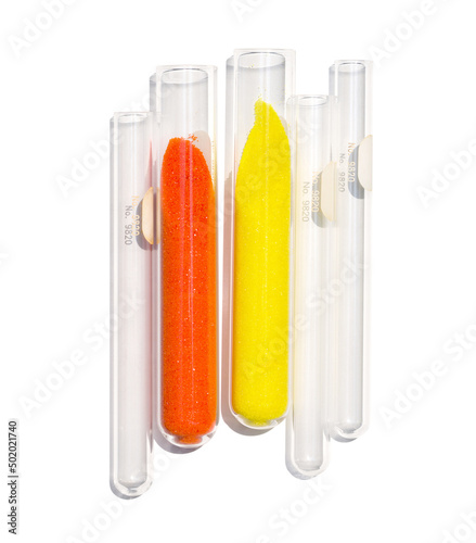 Closeup chemical ingredient on white laboratory table. Potassium Ferricyanide and Potassium Chromate powder in test tube. photo