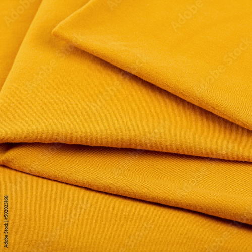 cotton textile - close up of fabric texture. Cotton Fabric Texture. Top View of Cloth Textile Surface. Clothing Background. Text Space. Abstract background and texture for designers.