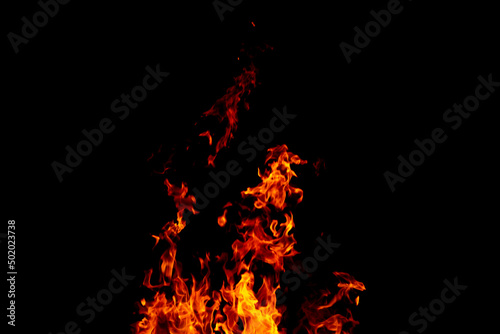 Bright fiery symbol on a black background. Fire background. Fire flame on a black background