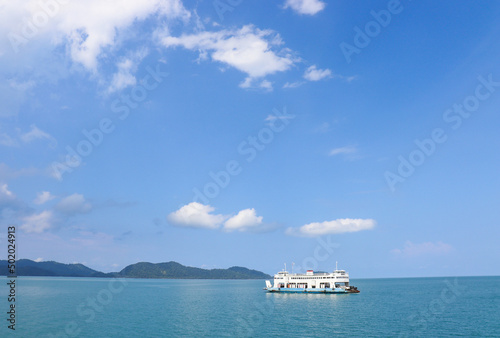 transport boat on sea with blue sky and clouds it's beautiful blue sky background. © sai