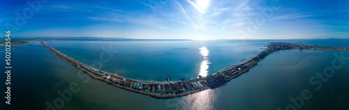 Panoramic view from a height above the town of Pomorie with houses and streets washed by the Black Sea in Bulgaria