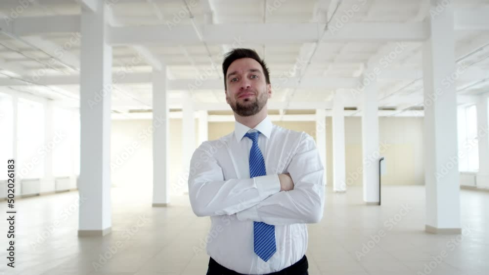 Realtor folds arms on chest after successful conclusion of lease agreement, front view. Realtor is satisfied after the successful sale of apartment Realtor folds arms on chest after successful conclusion of lease agreement, front view. Realtor is satisfied after the successful sale of apartment
