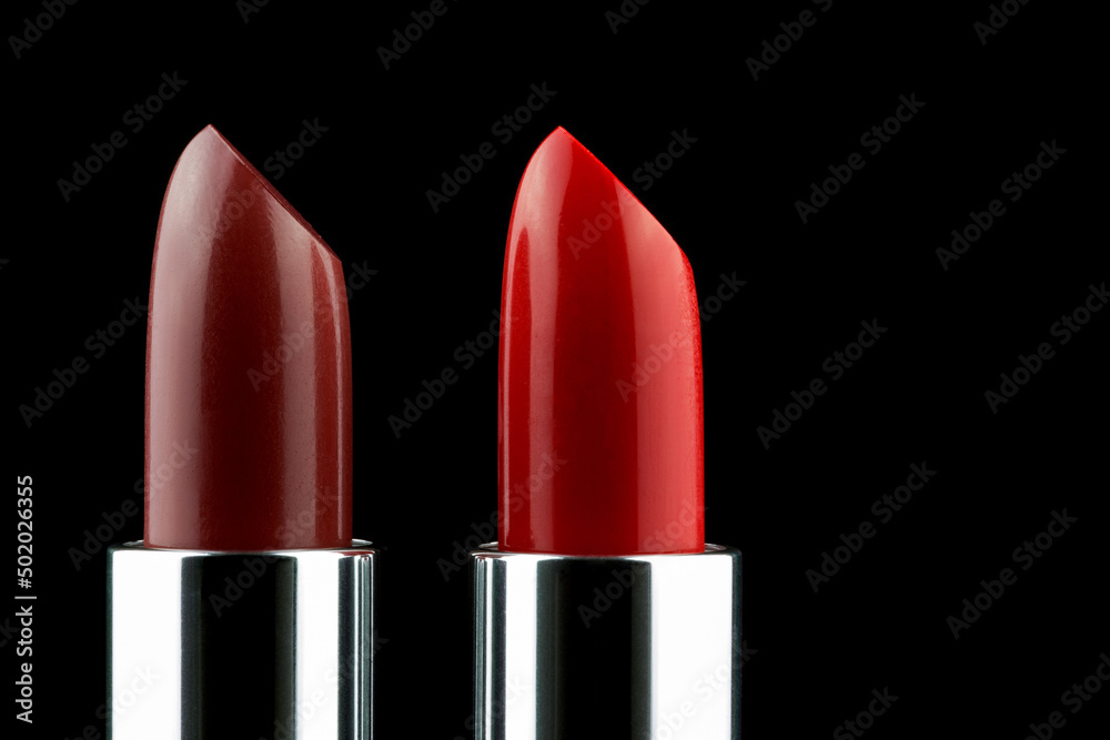 Two Lipsticks Upright on a Black Background Two Lipsticks Upright on a Black Background