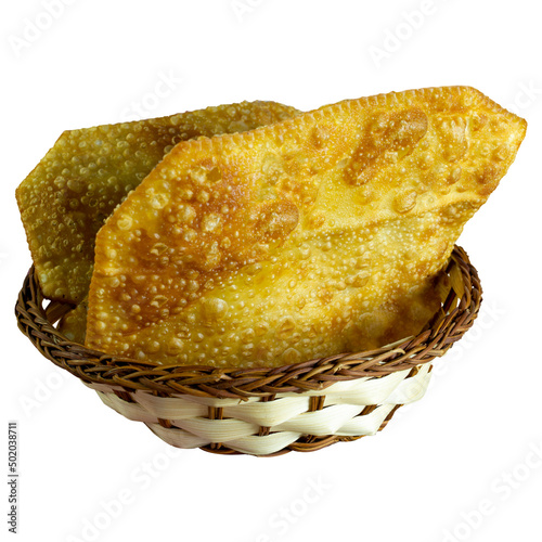 Brazilian pastel in a basket, isolated on white background