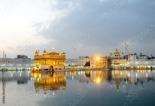 The golden temple of Sikh religion at sunset in Amritsar, Punjab, India.