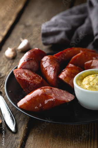 Grilled sausage with mustard sauce