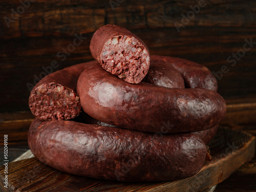 Blood sausage on wooden background