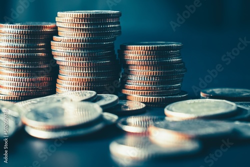 Pile of gold coins stack in finance treasury deposit bank account for saving . Concept of corporate business economy and financial growth by investment in valuable asset to gain cash revenue profit .