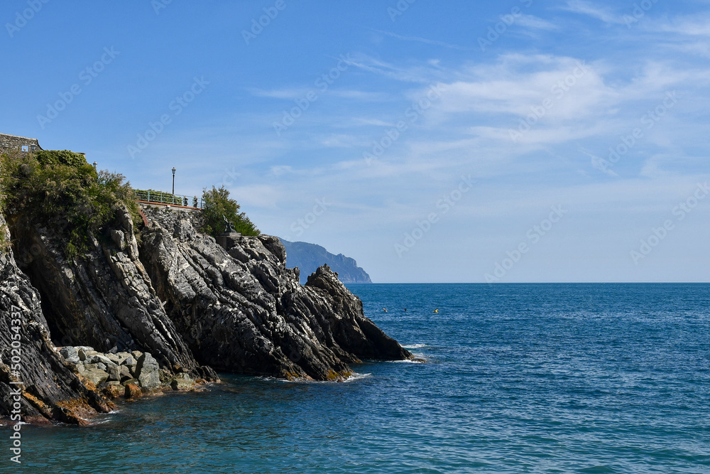 Seascape from the bay of Nervi with the Anita Garibaldi Promenade on top of the cliff and the promontory of Portofino in the background, Genoa, Liguria, Italy