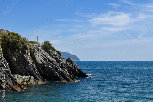 Seascape from the bay of Nervi with the Anita Garibaldi Promenade on top of the cliff and the promontory of Portofino in the background, Genoa, Liguria, Italy