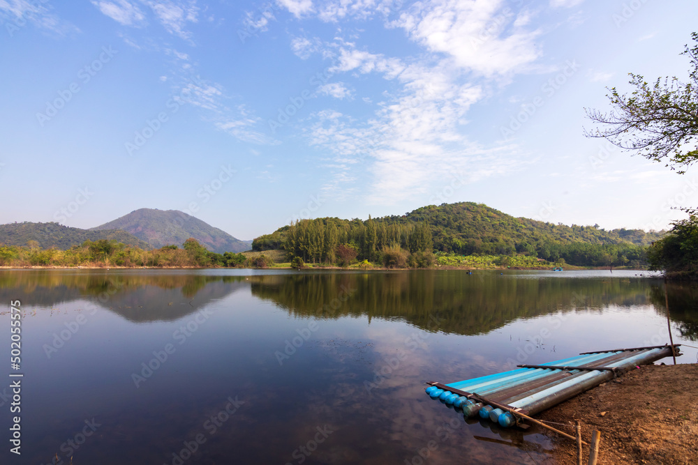 Beautiful landscape of lake and range of mountain with pine forest. Tha Khoei reservoir in Ratchaburi, Thailand. Beautiful landscape of lake and range of mountain with pine forest. Tha Khoei reservoir in Ratchaburi, Thailand.