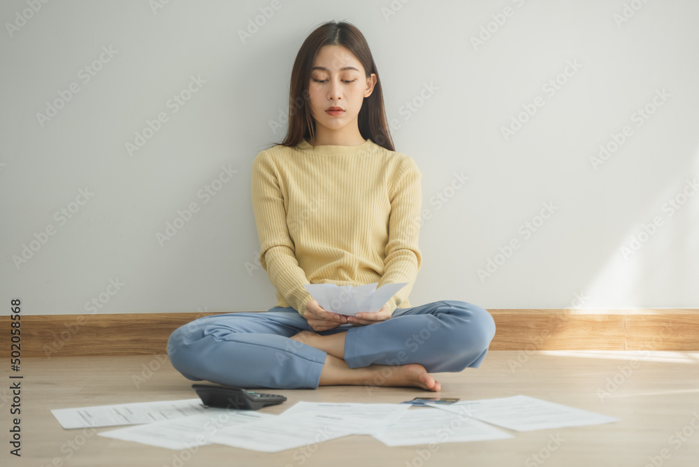 stressed young asian woman trying to find money to pay credit card deb stressed young asian woman trying to find money to pay credit card deb