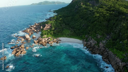 Aerial crane over Anse Marron beach in beautiful backlight in morning