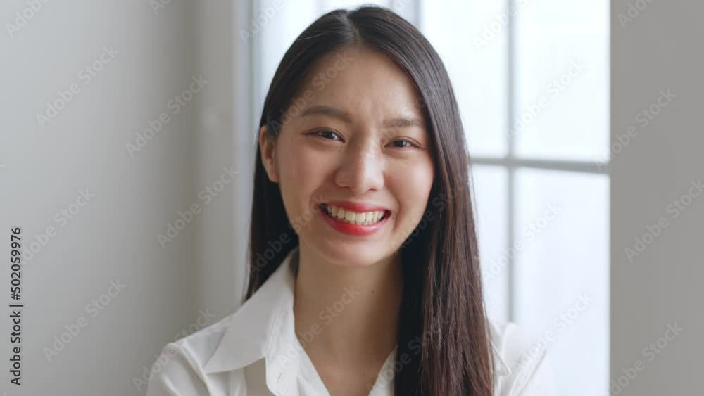 Portrait of young Asian businesswoman in white shirt working at office look at camera and smile Portrait of young Asian businesswoman in white shirt working at office look at camera and smile