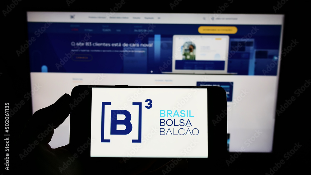 Stuttgart, Germany - 03-12-2022: Person holding cellphone with logo of  financial company B3 S.A. - Brasil, Bolsa, Balcao on screen in front of  webpage. Focus on phone display. Stock Photo | Adobe Stock