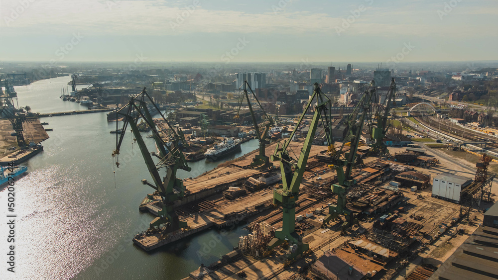A view of the Gdańsk Shipyard and cranes in the morning. An amazing sight that will take your breath away from the industral breathtaking view.