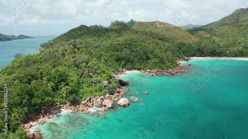 Aerial dolly descent to amazing beautiful Petite Anse Lazio beach