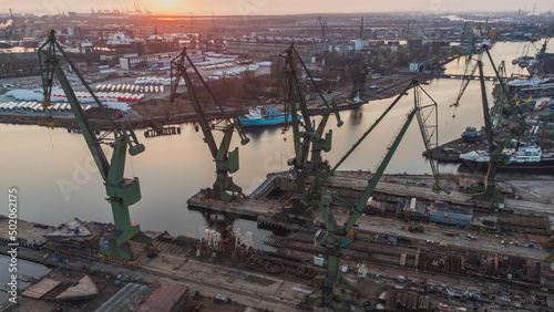 A view of the Gdańsk Shipyard and cranes in the morning. An amazing sight that will take your breath away from the industral breathtaking view.