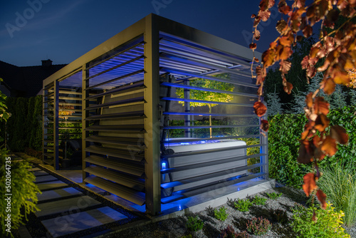 Gazebo with Hot Tub Inside a Modern Garden