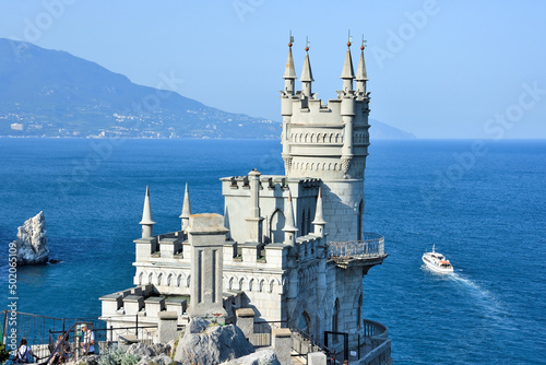 GASPRA, CRIMEA – JUNE 04, 2019: Castle Swallow's Nest on a rock at Black Sea, Crimea, Russia. It is a symbol and tourist attraction of Crimea photo