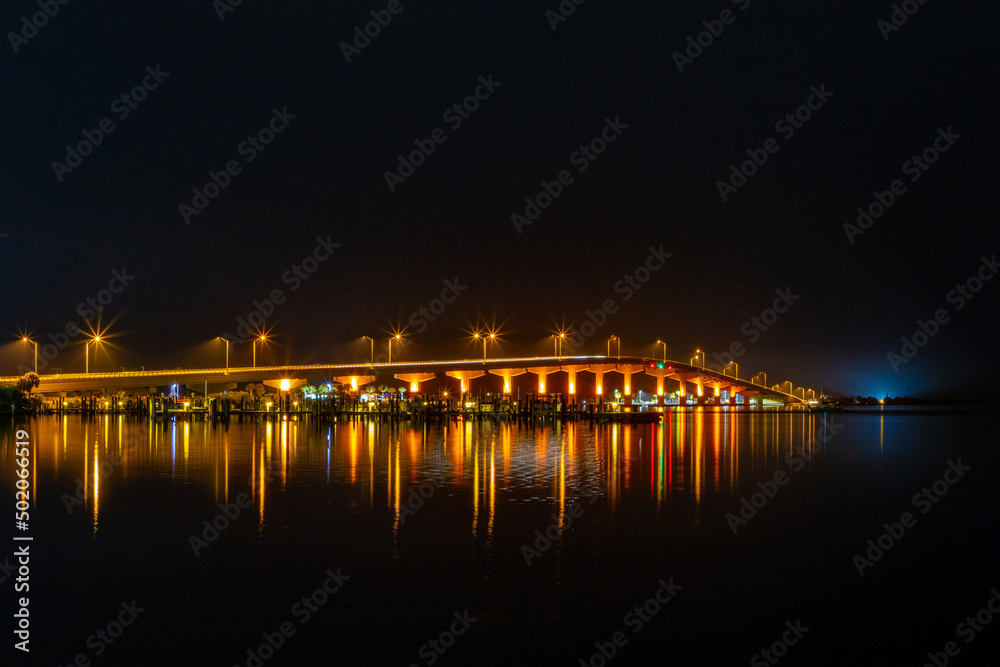 Bridge over water at night