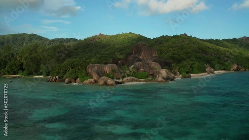 Aerial slider view to Anse Source d'Argent in the shadow of the clouds