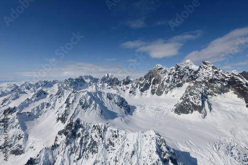 The rugged snow-covered mountains of the Alaska Range are a beautiful draw for Alaskan tourism.