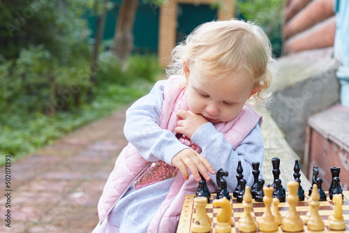child prodigy plays chess. The concept of development, training, education