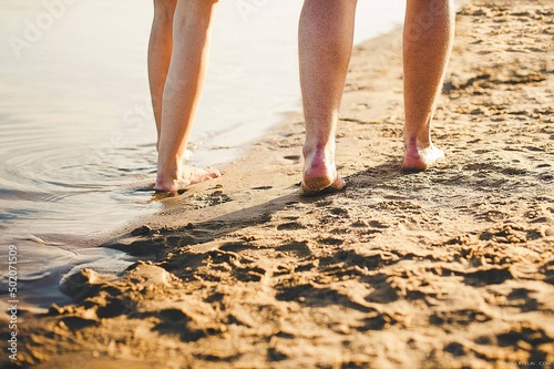 person walking on the beach