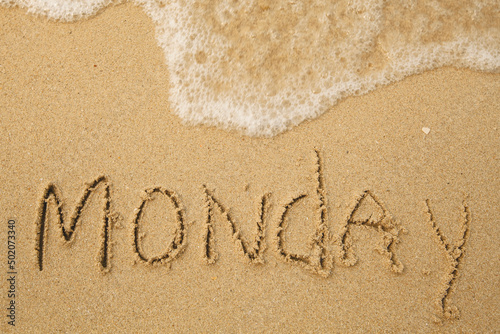 Monday - handwritten on the soft beach sand. © De Visu