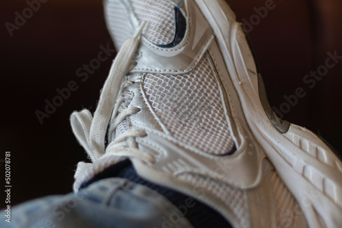 Close up photo of white sport shoe. Gym shoe. Training shoes.