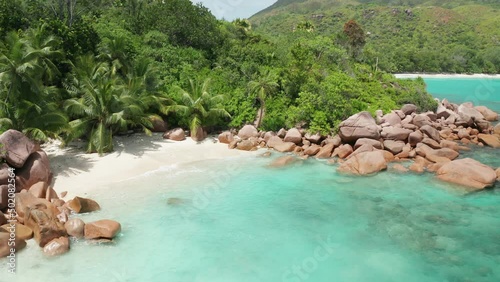 Aerial slider view to blue lagoon Petite Anse Lazio beach, Seychelles