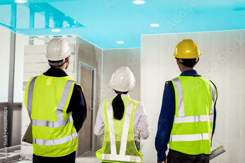 Construction Engineer team wearing technology goggles and use software connect with tablets to scan buildings and inspections to show augmented virtual reality in work, Building information model, BIM