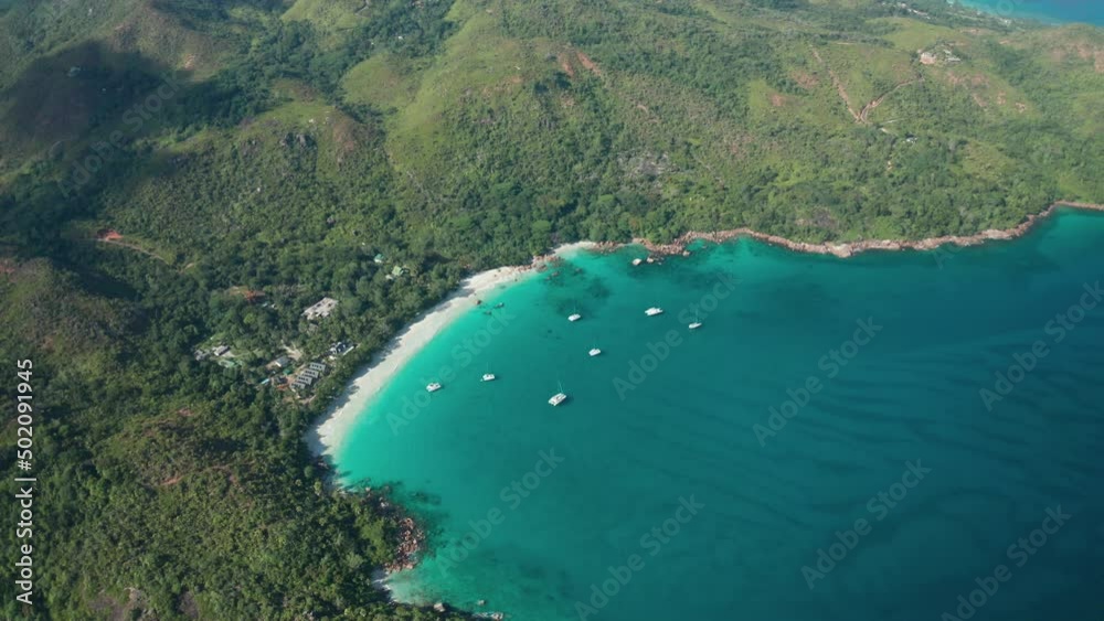 Aerial dolly tilt down over Anse Lazio beach at high altitude, Praslin Aerial dolly tilt down over Anse Lazio beach at high altitude, Praslin