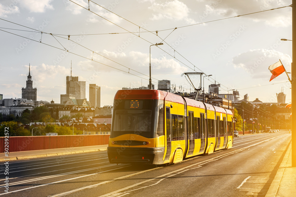 Tram in the city. Public transport concept. Warsaw, Poland - obrazy, fototapety, plakaty 