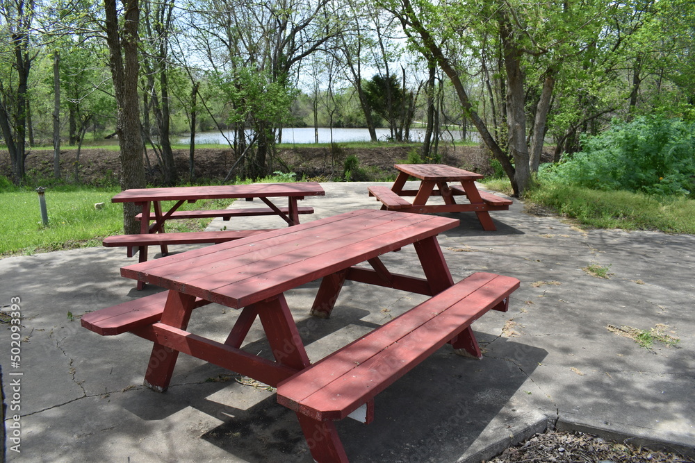 Picnic tables in a Park Picnic tables in a Park