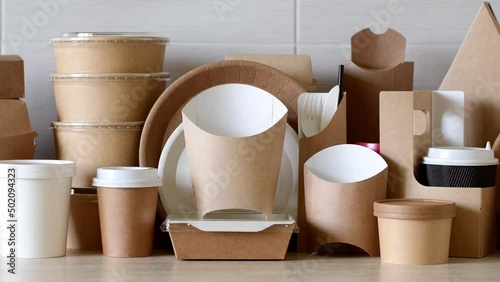 Paper eco-friendly disposable tableware. A large set of dishes and packaging for fast food. Panorama.