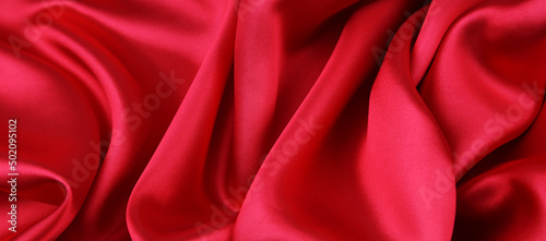 Closeup of rippled red silk fabric 