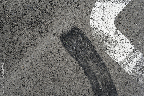 Wallpaper Mural Asphalt texture with white line and tire marks. Smooth asphalt road. Tarmac dark grey grainy road background.Top view Torontodigital.ca