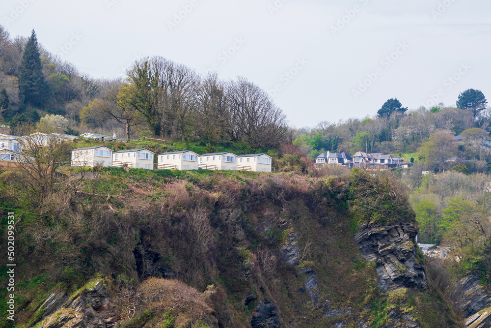 Naklejka premium Camping on a cliff. Small holiday houses outside of a town