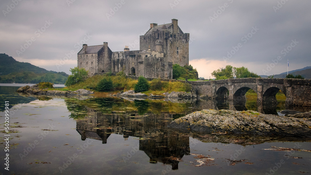 Overcast sunset light on Eilean Donan Castle on Lochalsh, Highlands, Scotland Overcast sunset light on Eilean Donan Castle on Lochalsh, Highlands, Scotland