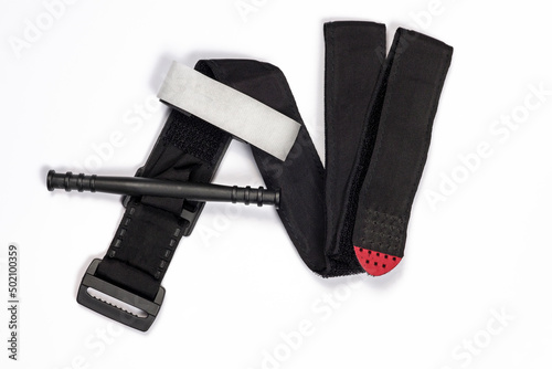 Hemostatic tourniquet on a white background top view. A tourniquet to stop bleeding. Bandaging the wounded. Military medicine for the treatment of wounds. Constriction of bleeding