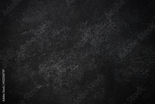 Black stone background. Empty surface for design.