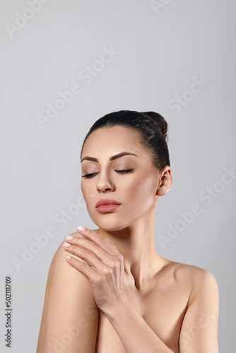Skin Care. Woman With Beauty Face Touching Healthy Facial Skin Portrait. Beautiful Smiling Girl Model With Natural Makeup Touching Her Skin.