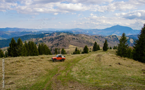 mountain landscape with offroad car. Romania
